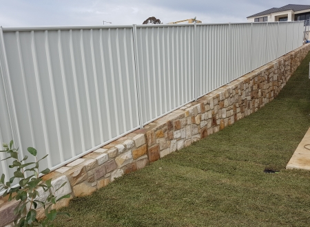 Colorbond with rock wall